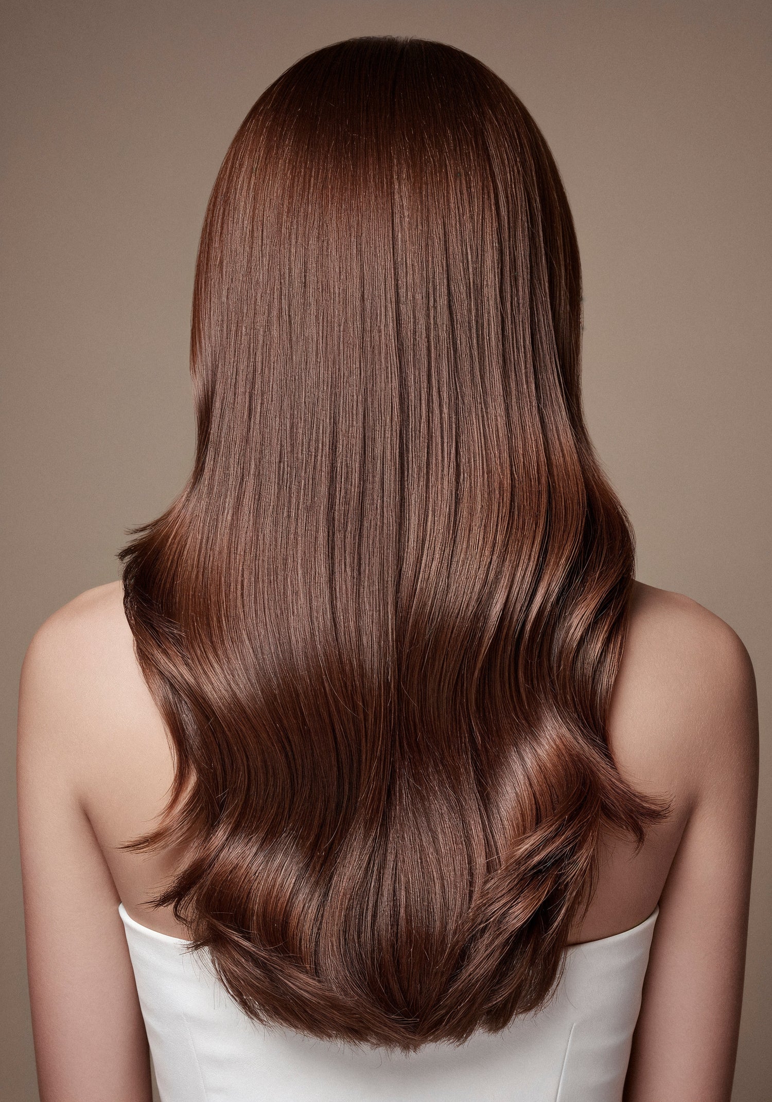 A model with long, shiny, healthy hair is shown holding Sujal Herbal Bhringraj & Amla Shampoo and Hair Oil bottles. The packaging is herbal-themed with green and natural colors, representing 100% herbal hair care made for all hair types